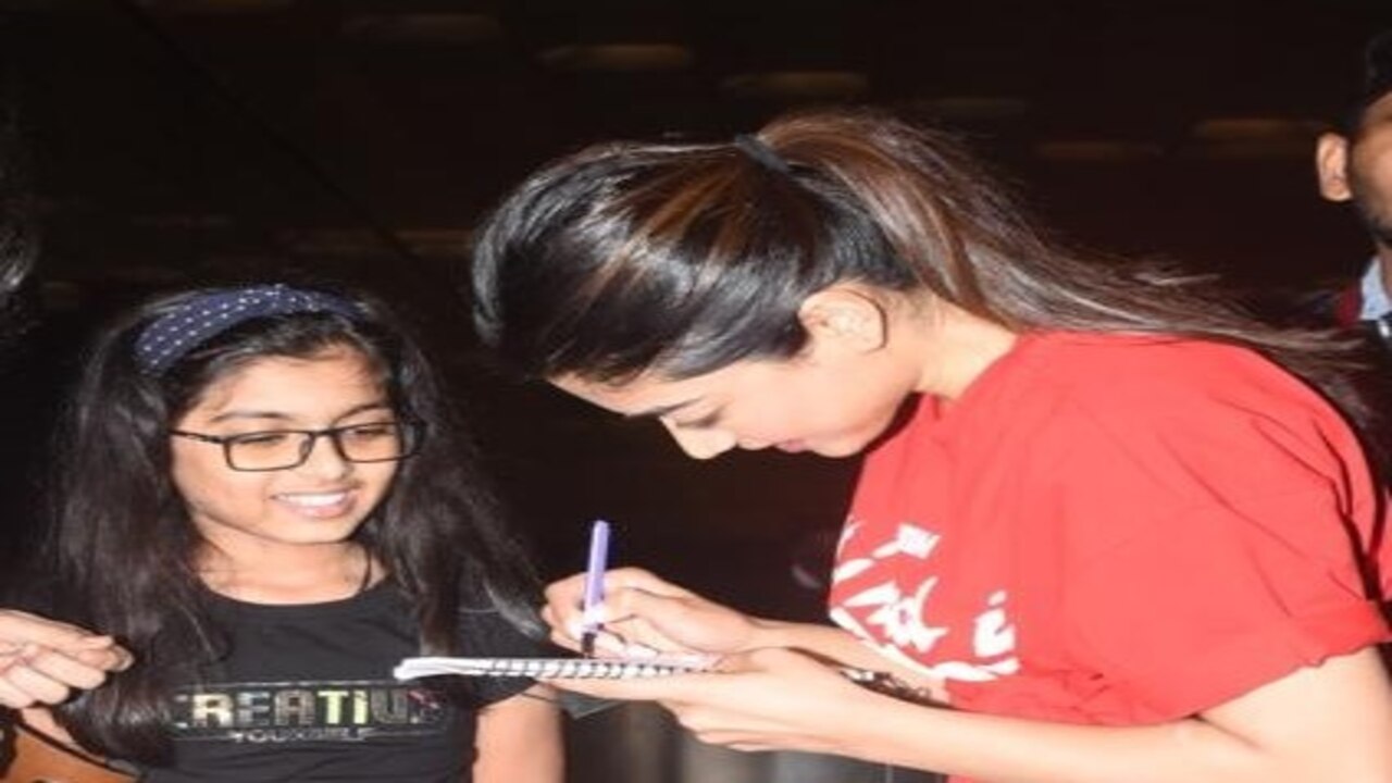 Rashmika Mandanna obliges a young fan with autograph as she gets papped at the airport