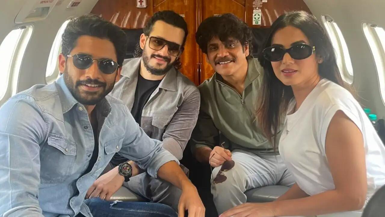 Nagarjuna, Naga Chaitanya, Akhil Akkineni, & Sonal Chauhan pose in the flight as they head for the pre-release event of The Ghost