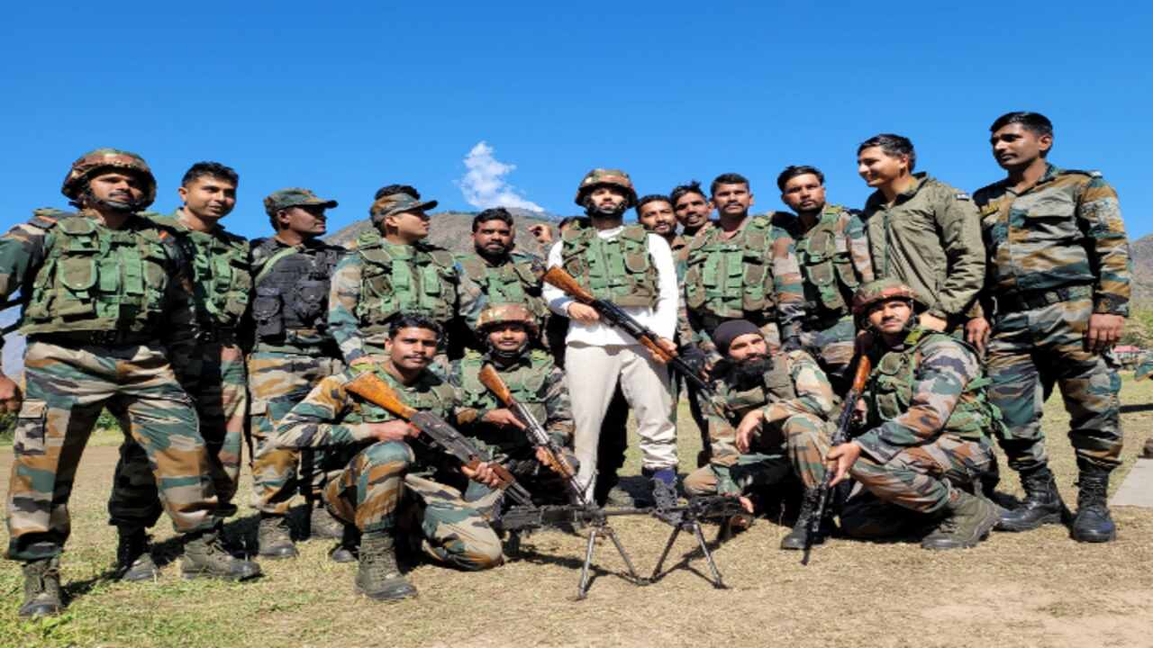 Vijay Deverakonda holds a rifle as he visits Uri to meet the soldiers