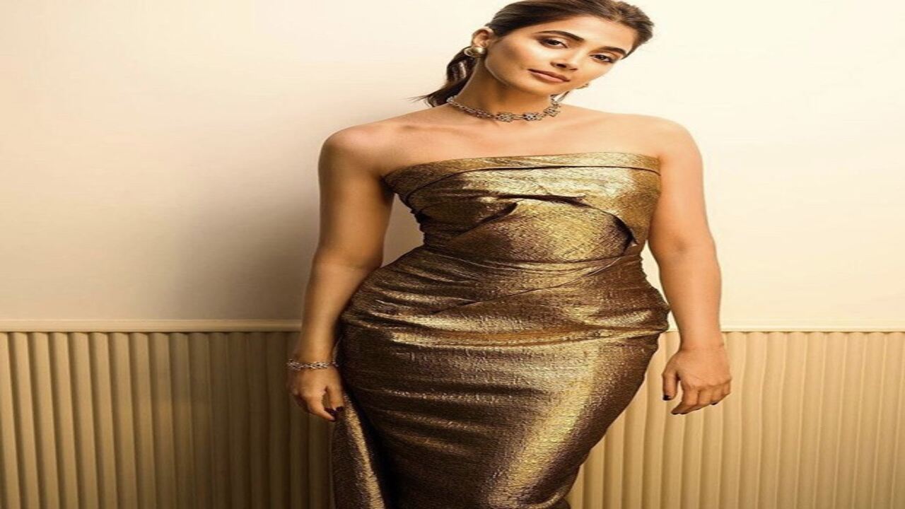 Pooja Hegde is a glam queen in a strapless golden gown
