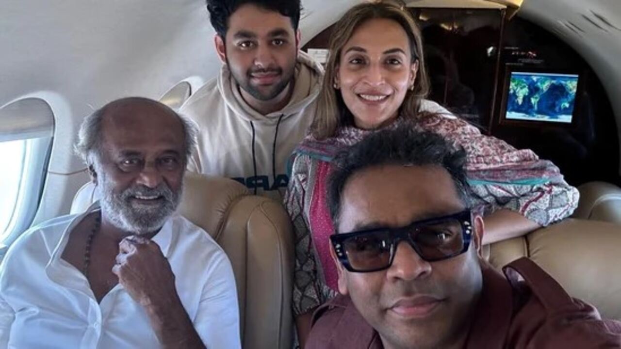 Rajinikanth poses with AR Rahman and daughter Aishwaryaa for selfie inside private jet